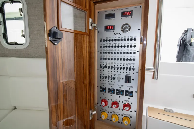  Yacht Photos Pics Electrical control panel inside 2025 HCB 42 Lujo boat, featuring switches and gauges.
