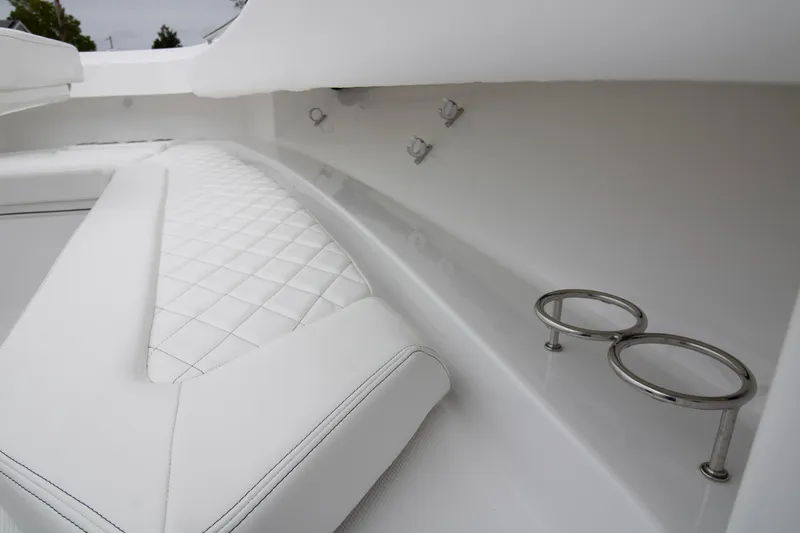  Yacht Photos Pics 2025 HCB 42 Lujo boat interior with white quilted seating and cup holders.