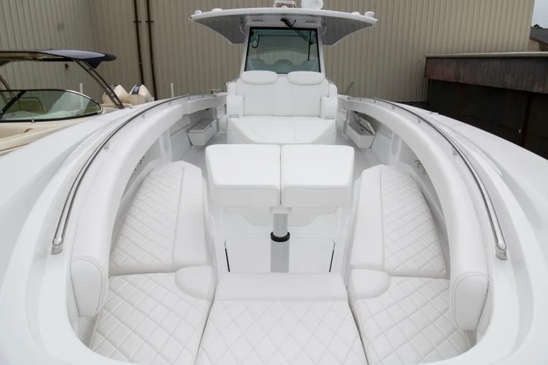  Yacht Photos Pics 2025 HCB 42 Lujo boat with luxurious white seating and sleek design.