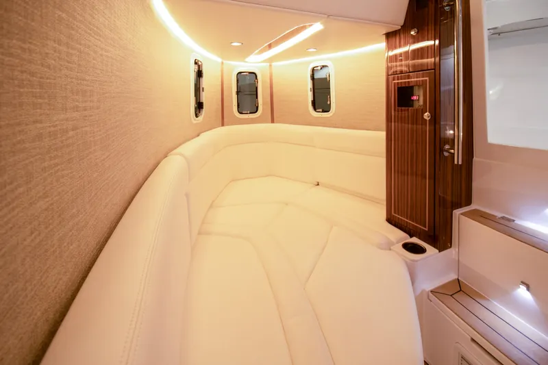  Yacht Photos Pics Luxurious interior of 2025 HCB 42 Lujo boat with elegant seating and ambient lighting.