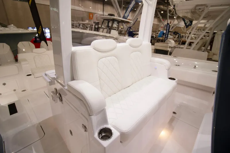  Yacht Photos Pics 2025 HCB 42 Lujo luxury boat interior with white seating and cup holders.
