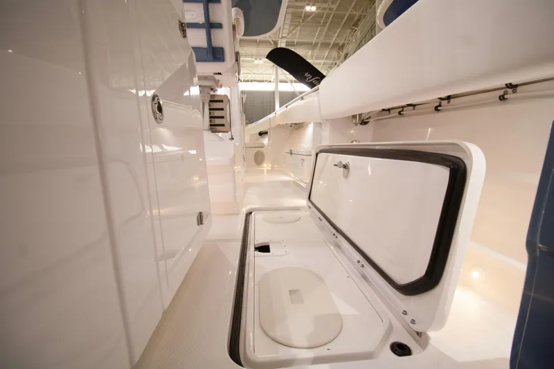  Yacht Photos Pics 2025 HCB 42 Lujo boat interior with open storage compartment, sleek white design.