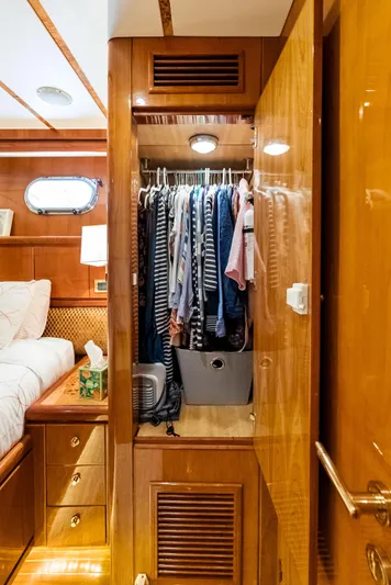 Tortuga Yacht Photos Pics Wooden closet with clothes inside Monte Fino 82 yacht, 1999 model.