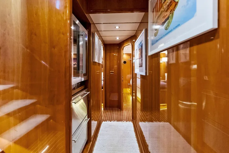 Tortuga Yacht Photos Pics Luxurious wooden interior hallway of 1999 Monte Fino 82 yacht.
