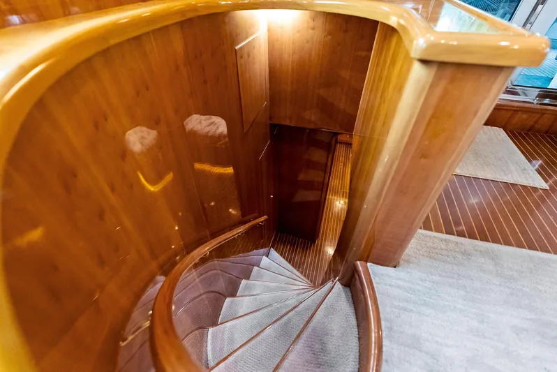Tortuga Yacht Photos Pics Luxurious wooden staircase on 1999 Monte Fino 82 yacht interior.