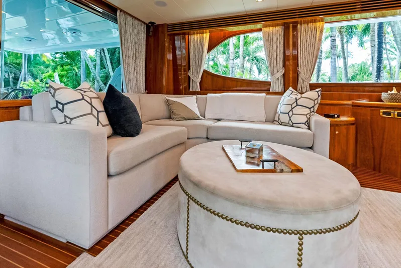 Tortuga Yacht Photos Pics Luxurious Monte Fino 82 yacht interior with elegant seating, wooden accents, and large windows, 1999 model.