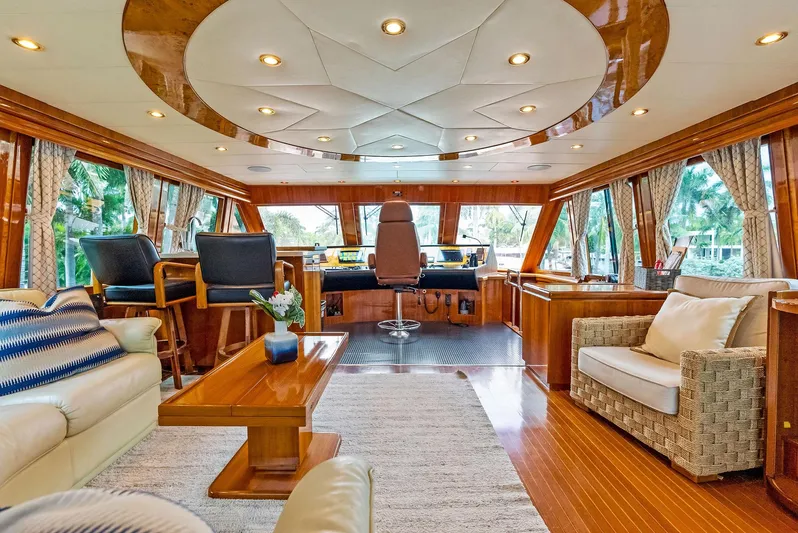 Tortuga Yacht Photos Pics Luxurious interior of a 1999 Monte Fino 82 yacht with elegant wood finishes.