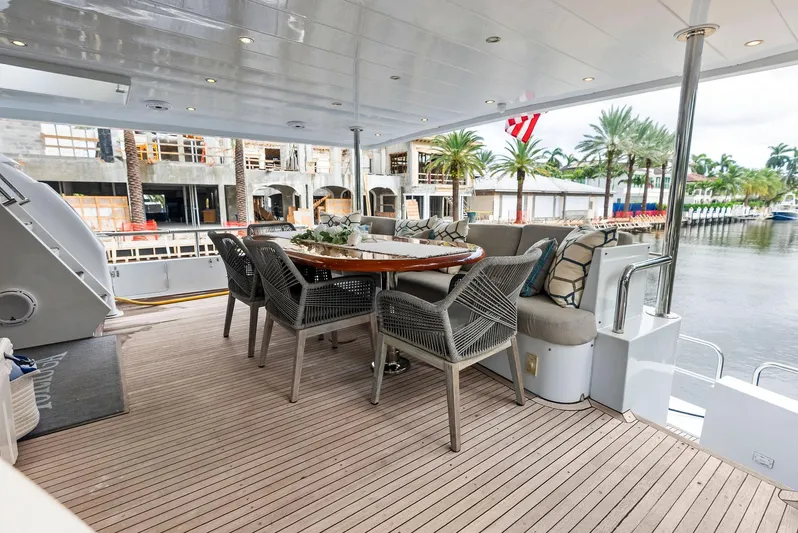 Tortuga Yacht Photos Pics Spacious deck of 1999 Monte Fino 82 yacht with elegant outdoor seating.