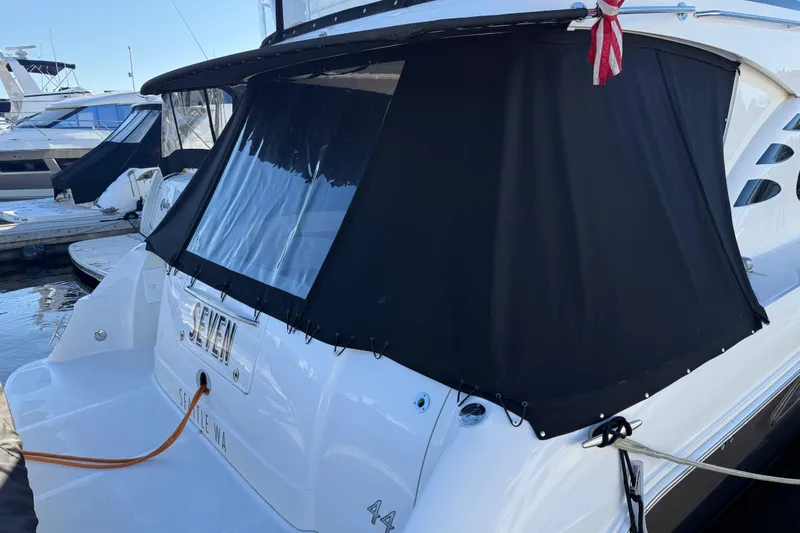  Yacht Photos Pics 2006 Sea Ray 44 Sedan Bridge yacht docked with black canvas cover.