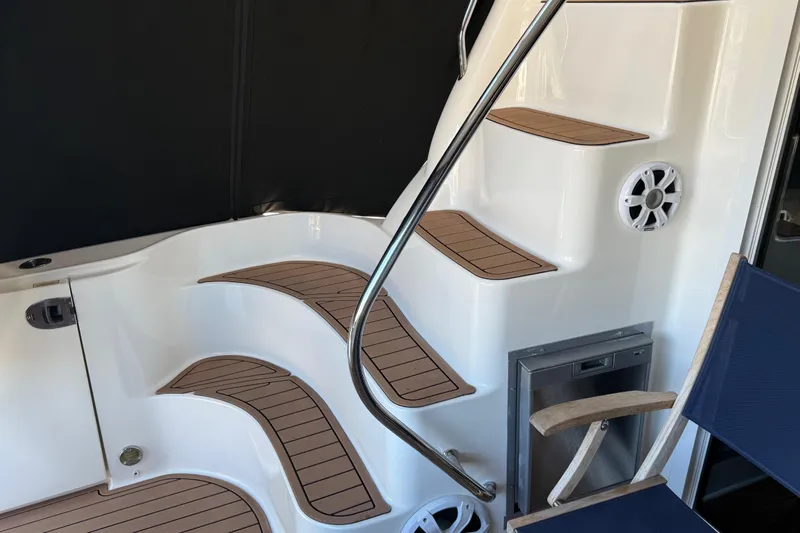  Yacht Photos Pics Staircase on 2006 Sea Ray 44 Sedan Bridge yacht with wood accents and seating.