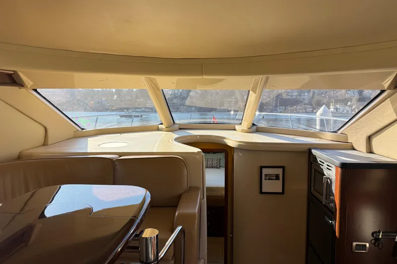  Yacht Photos Pics Interior view of 2006 Sea Ray 44 Sedan Bridge yacht with panoramic windows.