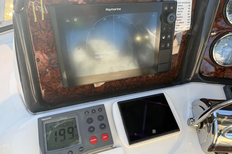 Yacht Photos Pics Control panel of 2006 Sea Ray 44 Sedan Bridge with Raymarine navigation system.