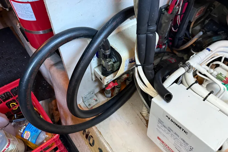  Yacht Photos Pics Engine room of 2006 Sea Ray 44 Sedan Bridge with hoses and equipment.