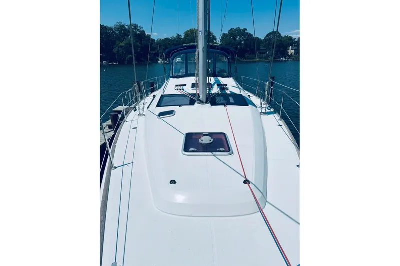 Bluefin Yacht Photos Pics 2008 Jeanneau Sun Odyssey 45 DS sailboat deck with clear sky and water backdrop.