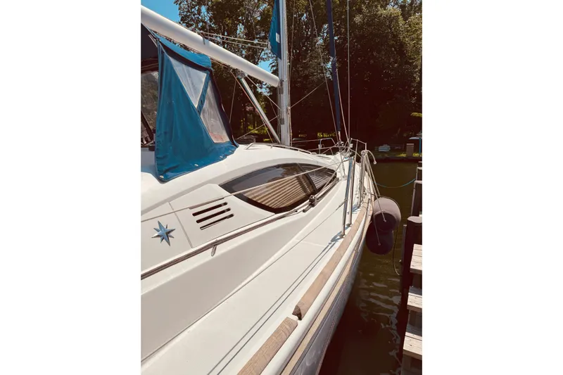 Bluefin Yacht Photos Pics 2008 Jeanneau Sun Odyssey 45 DS sailboat docked, featuring sleek design and blue accents.