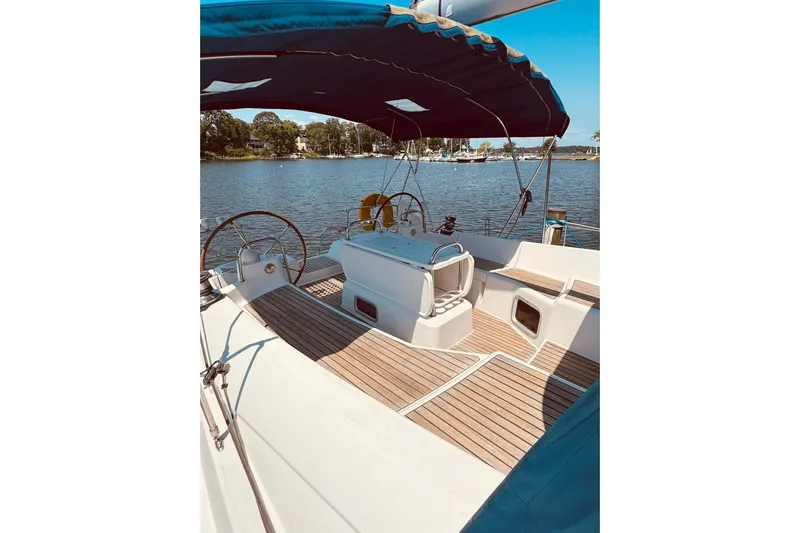 Bluefin Yacht Photos Pics 2008 Jeanneau Sun Odyssey 45 DS sailboat with spacious deck and scenic water view.