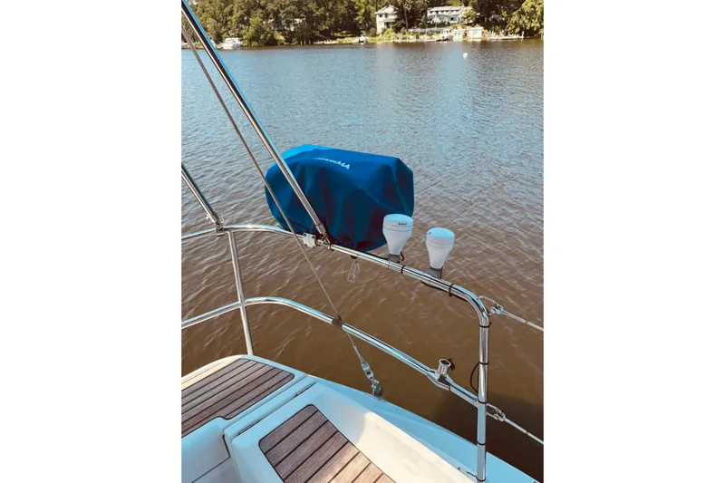 Bluefin Yacht Photos Pics Jeanneau Sun Odyssey 45 DS sailboat deck overlooking calm waters, 2008 model.