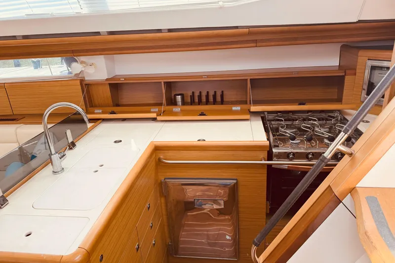 Bluefin Yacht Photos Pics Interior of 2008 Jeanneau Sun Odyssey 45 DS yacht kitchen with stove and sink.