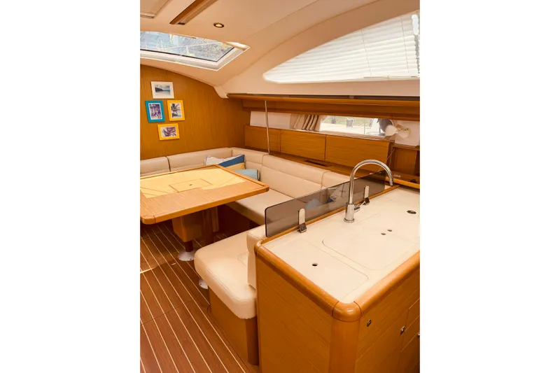 Bluefin Yacht Photos Pics Interior of 2008 Jeanneau Sun Odyssey 45 DS yacht, featuring elegant wood finishes and cozy seating.
