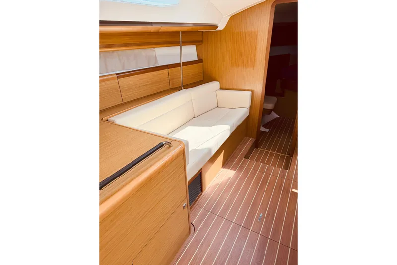 Bluefin Yacht Photos Pics Interior of 2008 Jeanneau Sun Odyssey 45 DS yacht with wooden finish and white seating.