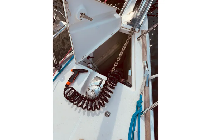 Bluefin Yacht Photos Pics Anchor locker of 2008 Jeanneau Sun Odyssey 45 DS with coiled hose and chain.