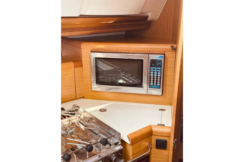 Bluefin Yacht Photos Pics Microwave and stove in 2008 Jeanneau Sun Odyssey 45 DS yacht kitchen.