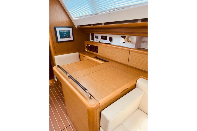 Bluefin Yacht Photos Pics Interior of 2008 Jeanneau Sun Odyssey 45 DS yacht with wooden cabinetry and seating.