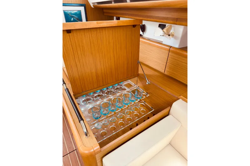 Bluefin Yacht Photos Pics Interior of 2008 Jeanneau Sun Odyssey 45 DS with built-in glass storage.