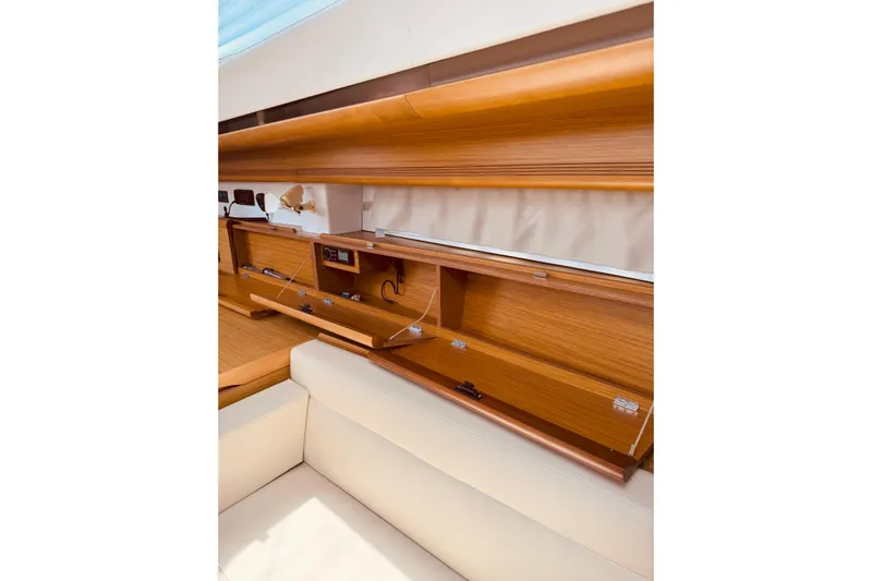 Bluefin Yacht Photos Pics Interior of 2008 Jeanneau Sun Odyssey 45 DS, featuring wooden cabinetry and beige seating.