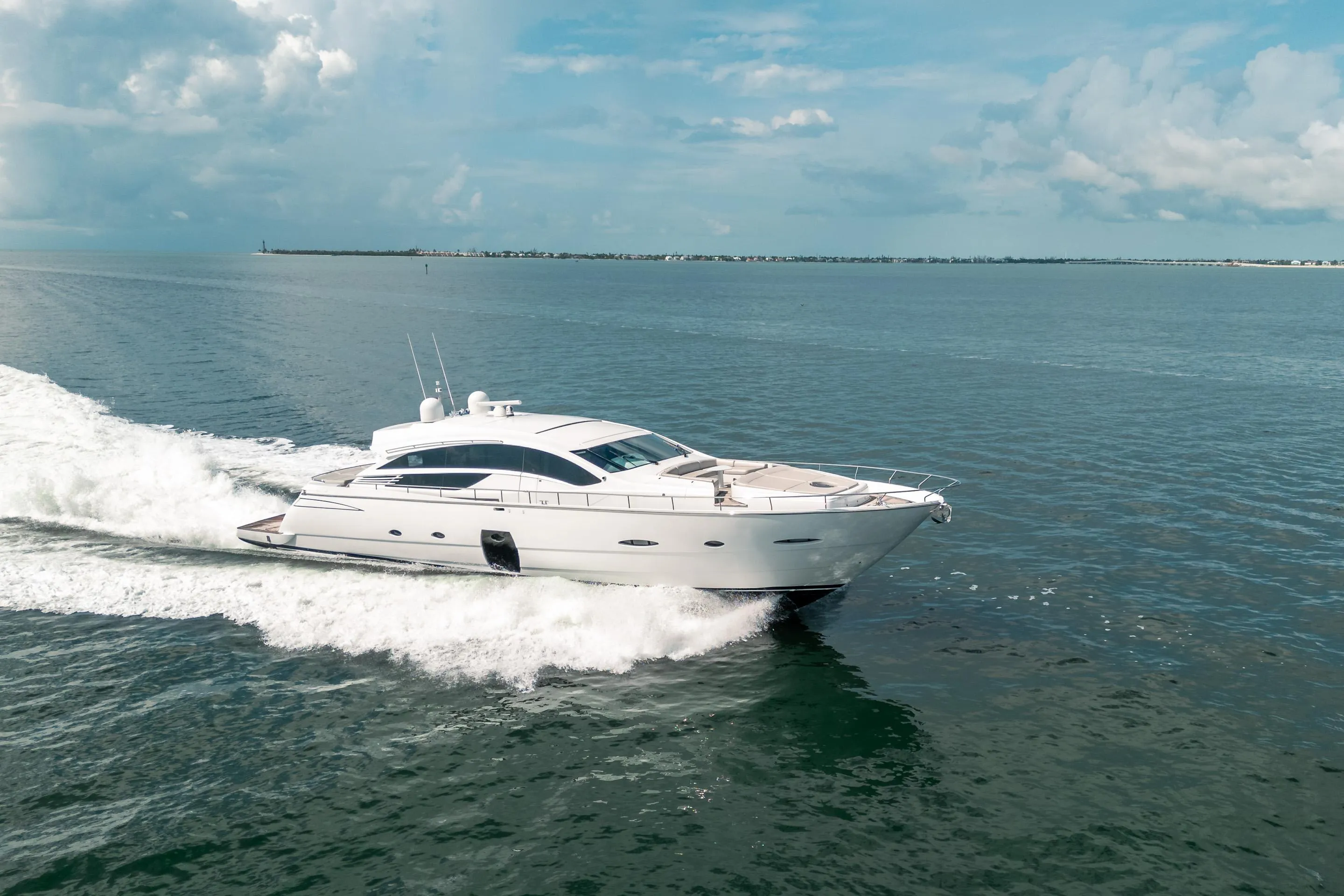 2010 Pershing 80 yacht cruising on open water under a clear sky.