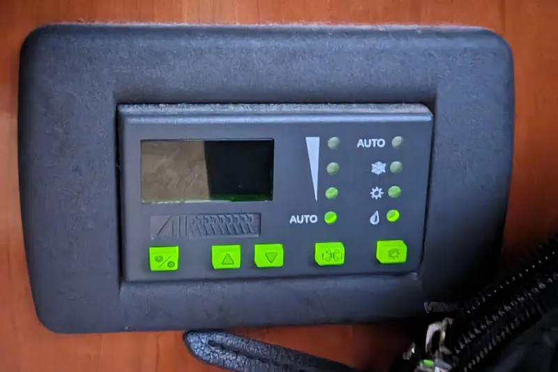  Yacht Photos Pics Control panel on 2004 Carver 360 Mariner boat with green buttons and display.