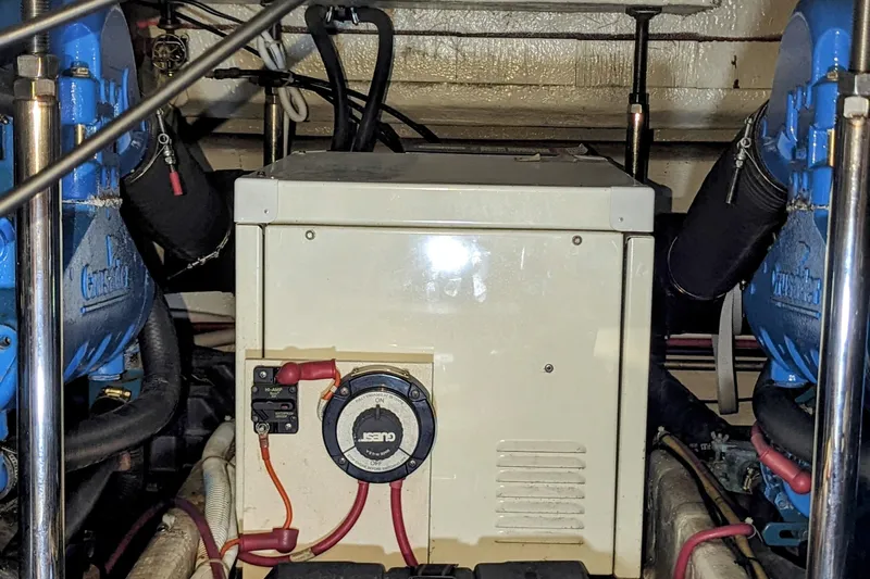  Yacht Photos Pics Engine room of a 2004 Carver 360 Mariner, featuring mechanical components and wiring.