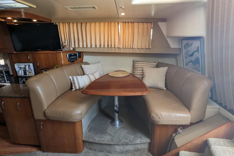  Yacht Photos Pics Interior of 2004 Carver 360 Mariner yacht with cozy dining area and plush seating.