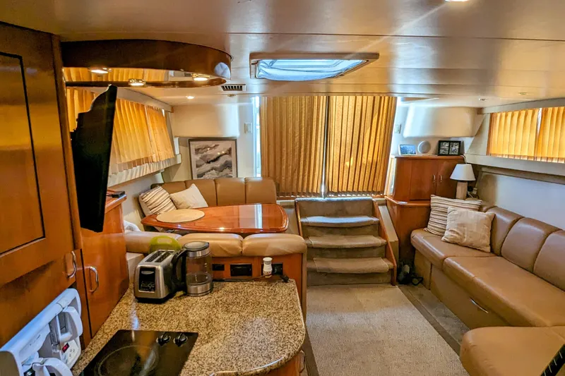  Yacht Photos Pics Luxurious interior of 2004 Carver 360 Mariner yacht with cozy seating and modern amenities.