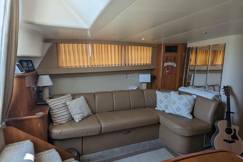  Yacht Photos Pics Luxurious interior of 2004 Carver 360 Mariner yacht with cozy seating and decor.