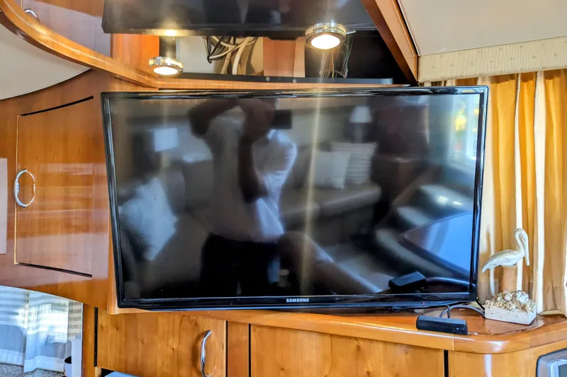  Yacht Photos Pics 2004 Carver 360 Mariner interior with Samsung TV and wooden cabinetry.