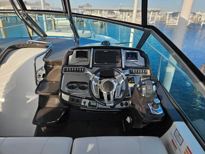 Second Half Yacht Photos Pics Cockpit of 2016 Monterey 355 Sport Yacht with modern controls and steering wheel.