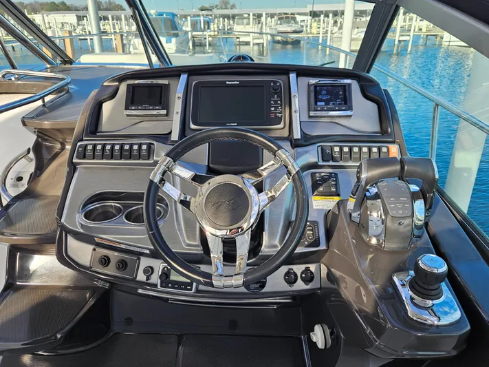 Second Half Yacht Photos Pics Cockpit of 2016 Monterey 355 Sport Yacht with advanced navigation controls and steering wheel.