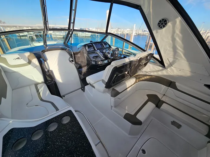 Second Half Yacht Photos Pics Interior of 2016 Monterey 355 Sport Yacht with modern helm and seating, docked at marina.