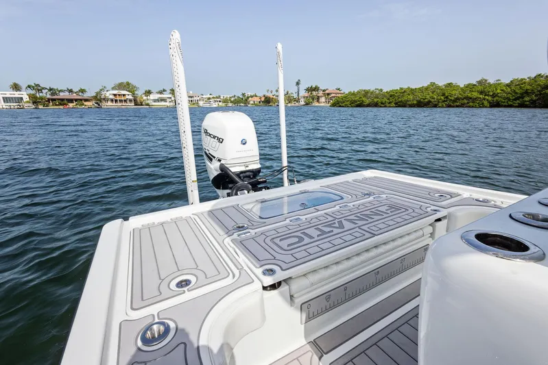  Yacht Photos Pics 2018 Barker Boatworks 26 Calibogue Bay on water, featuring deck and motor.