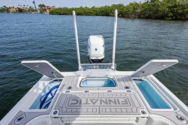  Yacht Photos Pics 2018 Barker Boatworks 26 Calibogue Bay on water, showcasing deck and motor.