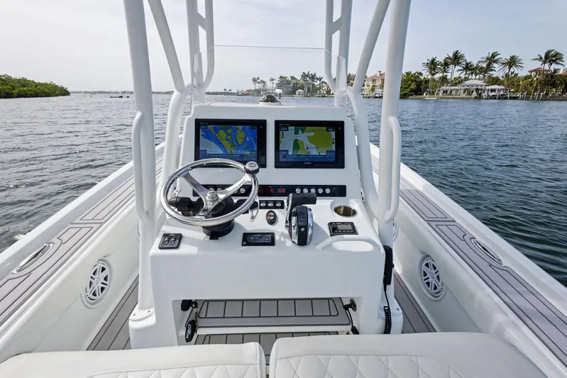  Yacht Photos Pics 2018 Barker Boatworks 26 Calibogue Bay console with dual navigation screens on calm water.