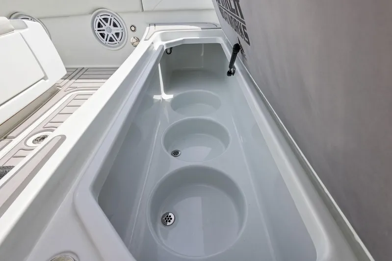  Yacht Photos Pics 2018 Barker Boatworks 26 Calibogue Bay interior storage compartment with circular recesses.