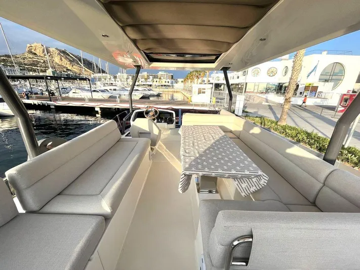 Rialtin Yacht Photos Pics Luxurious interior of 2022 Beneteau Monte Carlo 52 yacht at marina.
