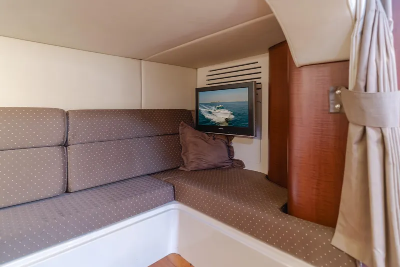 Giddy Up Yacht Photos Pics Interior of 2009 Boston Whaler 345 Conquest with cozy seating and TV.