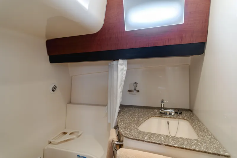 Giddy Up Yacht Photos Pics 2009 Boston Whaler 345 Conquest bathroom with sink and countertop.