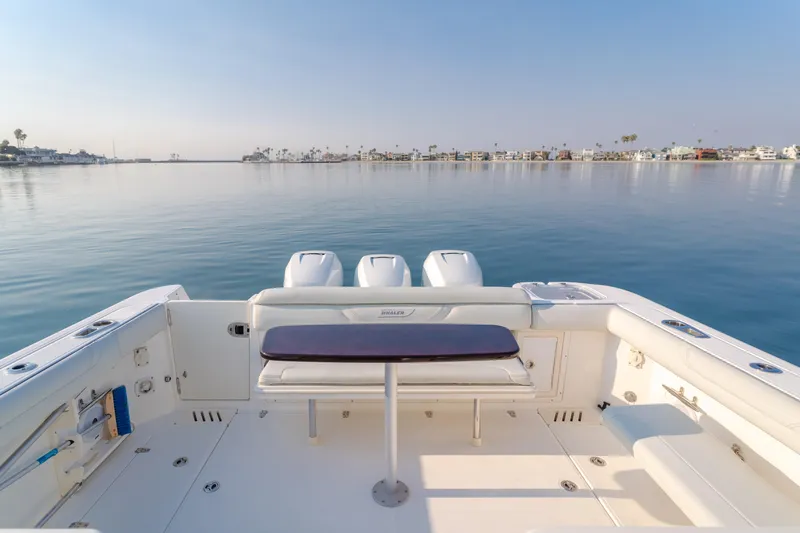 Giddy Up Yacht Photos Pics Boston Whaler 345 Conquest 2009 boat deck with serene water view.