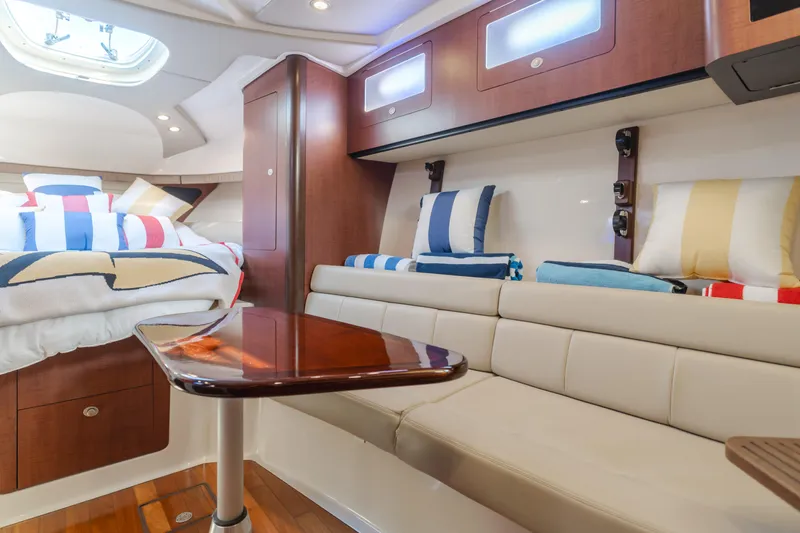 Giddy Up Yacht Photos Pics Luxurious interior of 2009 Boston Whaler 345 Conquest with cozy seating and stylish decor.