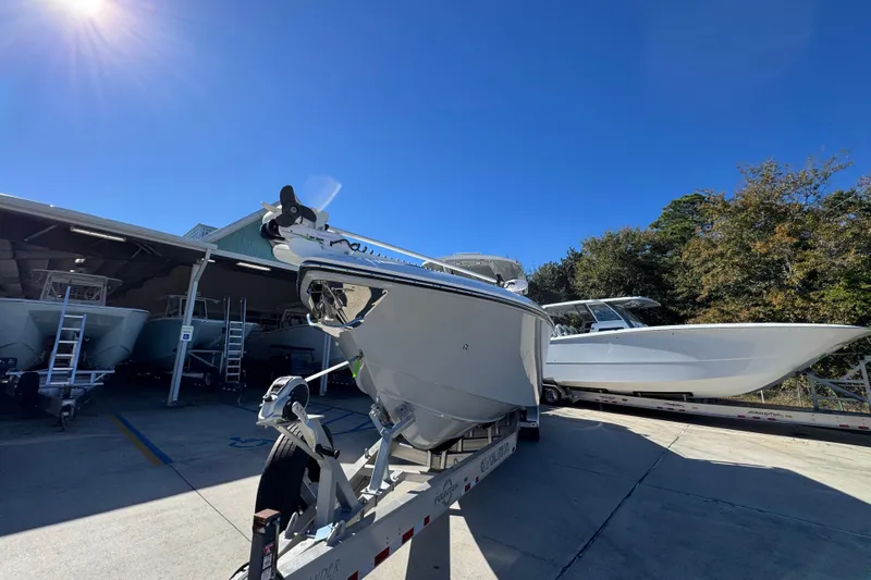  Yacht Photos Pics 2023 Fountain 34 Tournament Edition boat on trailer under clear blue sky.