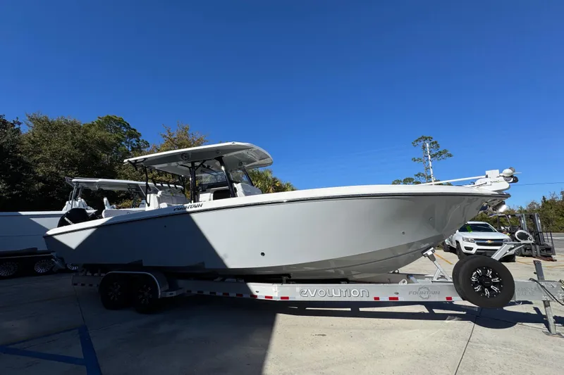  Yacht Photos Pics 2023 Fountain 34 Tournament Edition boat on trailer under clear blue sky.